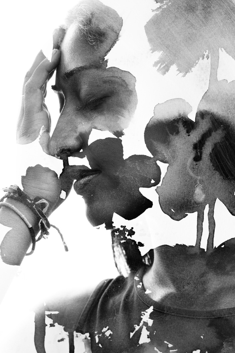 A serene profile blended with ink-bloom flowers, representing emotional release