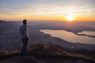 Hypnosis Solution Therapy man looking out over water at sunset
