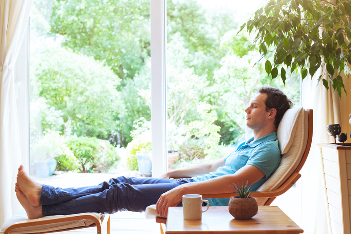 Man relaxing at home after work, sleep and having rest on weekend